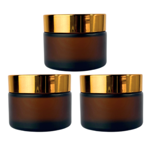 Pote de vidrio esmerilado ámbar con tapa a rosca dorada, blanca o negra y contratapa interna. Envase cosmético de 30g y 50g ideal para cremas, bálsamos y productos de cuidado personal.