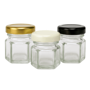 bollon mini hexagonal 40ml, bollon mini hexagonal, bollón vidrio hexagonal, frasco mini vidrio 40ml, envase pequeño vidrio con tapa, bollón dorado artesanal, frasco miel miniatura, envase vidrio souvenir, mini frasco cosmética, bollón hexagonal tapa metálica, frasquito decorativo vidrio, envase gourmet 40ml